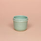Delicate ceramic cup in turquoise color.