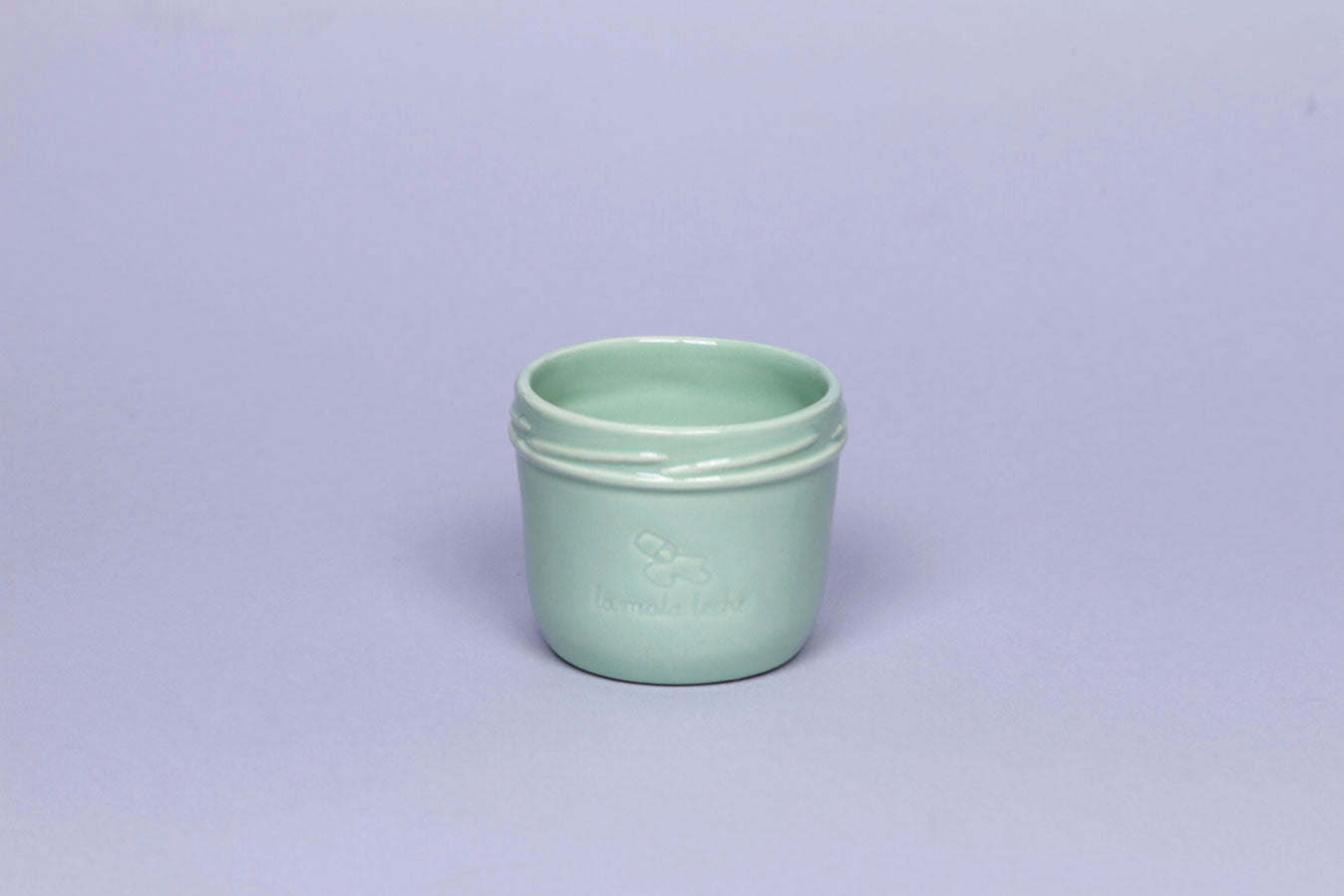 Delicate ceramic cup in turquoise color.