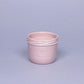Delicate ceramic cup in light pink color.
